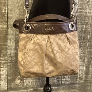 Authentic Coach cross body bag with top handle.